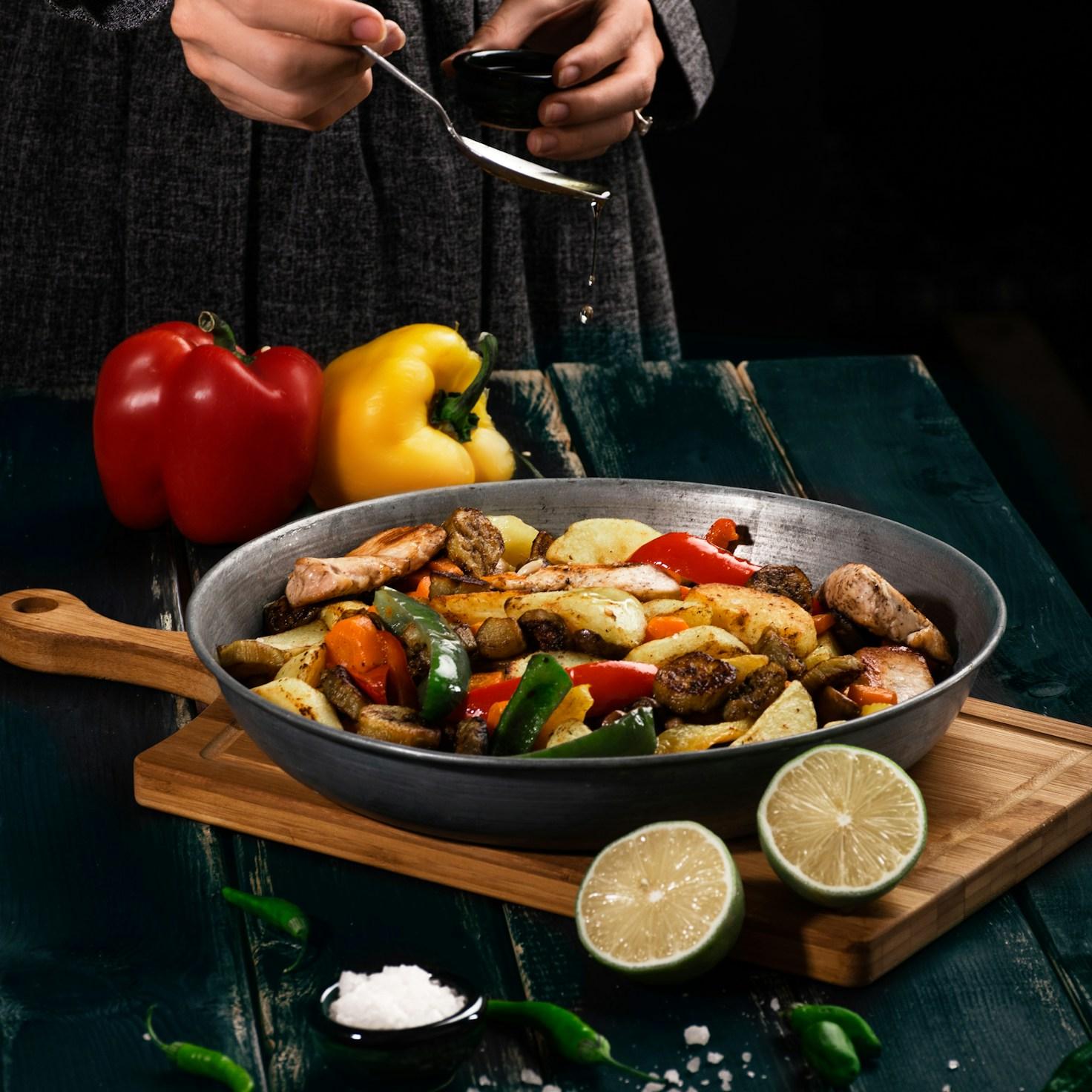 Community members working together in a modern kitchen, exchanging recipes and techniques